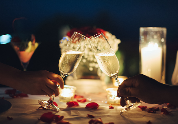 Two retaurant attendees toast with glasses